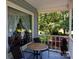 Relaxing covered porch with seating, offering a serene outdoor space to enjoy the surrounding greenery at 517 Powell St, Rock Hill, SC 29732