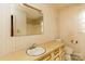 Neutral bathroom featuring a large mirror and vanity with cream cabinets, toilet, and bathtub/shower at 661 Blackwelder Rd, Statesville, NC 28625