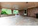 Expansive covered patio featuring brick columns, perfect for outdoor entertaining and relaxation with ample space at 661 Blackwelder Rd, Statesville, NC 28625