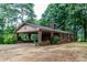 Single-story brick home with covered carport, showcasing classic design and convenient outdoor access at 661 Blackwelder Rd, Statesville, NC 28625