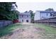 Large backyard showing the rear of the house and full fencing, offering privacy at 6919 Ware Rd, Charlotte, NC 28212