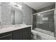 Modern bathroom featuring sleek vanity, stylish mirror, and tiled shower with glass door at 719 Dawn Cir, Charlotte, NC 28213
