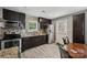 Updated kitchen featuring stainless steel appliances, granite countertops, and dark cabinetry at 719 Dawn Cir, Charlotte, NC 28213