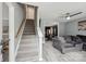Inviting interior featuring wood-look floors, stairs, and an open-concept living space at 719 Dawn Cir, Charlotte, NC 28213