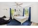 Bright bedroom featuring a ceiling fan, nice windows, a bed, and a comfy beanbag chair at 815 Lakeside Cir, Lancaster, SC 29720