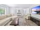 Spacious living room with plenty of light, wood floors, and modern furnishings at 815 Lakeside Cir, Lancaster, SC 29720