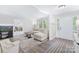 Bright living room featuring neutral walls, wood floors, and modern decor at 815 Lakeside Cir, Lancaster, SC 29720