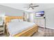 Light and airy bedroom with a ceiling fan and a dresser at 815 Lakeside Cir, Lancaster, SC 29720