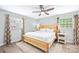 Comfortable bedroom featuring a ceiling fan and natural light from two windows at 815 Lakeside Cir, Lancaster, SC 29720
