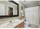 Bright bathroom featuring a mirror, new fixtures, and tub at 820 Settlement St, Clover, SC 29710