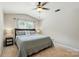 Cozy bedroom featuring a ceiling fan, carpet, and large window at 820 Settlement St, Clover, SC 29710