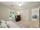 Bright bedroom with a daybed, window views, a dresser, closet, and a glimpse into an adjacent room at 820 Settlement St, Clover, SC 29710