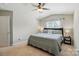 Cozy bedroom featuring a ceiling fan, carpet, and large window at 820 Settlement St, Clover, SC 29710