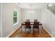 Elegant dining room with wood floors and a chandelier above the wood dining table at 820 Settlement St, Clover, SC 29710