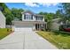 Charming two-story home with a two car garage, black shutters, and landscaped front yard at 820 Settlement St, Clover, SC 29710