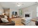 Cozy living room with fireplace, area rug, ceiling fan, and comfortable furniture at 820 Settlement St, Clover, SC 29710