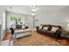 Spacious living room featuring hardwood floors, comfortable seating, and natural lighting at 820 Settlement St, Clover, SC 29710