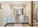 Functional bathroom with double vanity, ample lighting, and a clean design, providing everyday convenience at 8698 Rocky River Rd, Harrisburg, NC 28075
