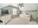 Bedroom with a bed, dresser, ceiling fan and natural light at 8698 Rocky River Rd, Harrisburg, NC 28075