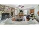 Comfortable living room featuring a stone fireplace and rustic wood accents at 8698 Rocky River Rd, Harrisburg, NC 28075