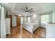 Serene main bedroom featuring trey ceiling, hardwood floors, and a private ensuite for ultimate comfort at 8698 Rocky River Rd, Harrisburg, NC 28075