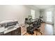 A bright office space with ample natural light and functional layout perfect for working from home at 8698 Rocky River Rd, Harrisburg, NC 28075