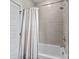 Clean bathroom with a shower-tub combination and white shower curtain at 919 Cityscape Dr, Charlotte, NC 28205