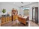 Charming dining room with vintage furniture, hardwood floors, and a bright window at 919 Cityscape Dr, Charlotte, NC 28205