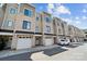 Stylish townhomes featuring brick and siding exteriors, garages, and modern design, nestled in a vibrant community at 919 Cityscape Dr, Charlotte, NC 28205