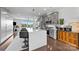 Spacious kitchen with a large island, bar stools, and seamless flow to the living area at 919 Cityscape Dr, Charlotte, NC 28205