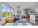 Inviting living room with expansive windows, a comfortable grey sectional, and modern decor at 919 Cityscape Dr, Charlotte, NC 28205
