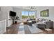 Bright living room features city views, a comfortable sectional, and contemporary decor at 919 Cityscape Dr, Charlotte, NC 28205