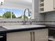 Bright kitchen sink area with garden window and modern faucet at 9404 S Vicksburg Park Ct, Charlotte, NC 28210