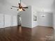 Bright living room with hardwood floors and a ceiling fan at 9404 S Vicksburg Park Ct, Charlotte, NC 28210