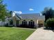 Beautiful one-story home with a well-kept lawn, complementing the appealing exterior at 9612 Farmridge Ln, Matthews, NC 28105