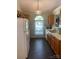 Traditional-style kitchen with hardwood floors and ample natural light from a window at 9612 Farmridge Ln, Matthews, NC 28105