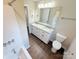 Bathroom featuring double sinks, granite countertops, and modern fixtures for a spa-like experience at 111 W Perry St, Heath Springs, SC 29058