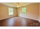 Bedroom featuring wood-look flooring and large windows for a bright and welcoming space at 111 W Perry St, Heath Springs, SC 29058