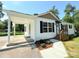 Side view of a cozy home with a covered carport and a well-manicured walkway leading to the front entrance at 111 W Perry St, Heath Springs, SC 29058
