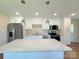 Well-lit kitchen featuring an island, stainless steel appliances, and granite countertops for a modern feel at 111 W Perry St, Heath Springs, SC 29058