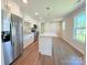 Modern kitchen boasts stainless steel appliances, an island, and plenty of white cabinetry for ample storage at 111 W Perry St, Heath Springs, SC 29058