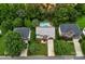 Beautiful aerial view of home with manicured lawn, mature trees, and a private in-ground pool in the backyard at 11917 Ulsten Ln, Huntersville, NC 28078