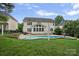 A backyard featuring a pool, patio, seating, and an outdoor grill at 11917 Ulsten Ln, Huntersville, NC 28078