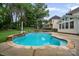 A backyard featuring a pool, patio, seating, and an outdoor grill at 11917 Ulsten Ln, Huntersville, NC 28078