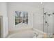 Relaxing bathroom with a jetted tub and a separate glass enclosed shower at 11917 Ulsten Ln, Huntersville, NC 28078