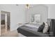 Cozy bedroom featuring a neutral color palette, ceiling fan, and natural light from the window at 11917 Ulsten Ln, Huntersville, NC 28078
