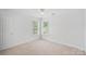Bedroom featuring natural light, carpet, and ceiling fan at 11917 Ulsten Ln, Huntersville, NC 28078