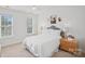 Bright bedroom featuring natural light, carpet, and ceiling fan at 11917 Ulsten Ln, Huntersville, NC 28078