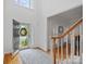 Bright, open foyer with hardwood floors and staircase, leading to the rest of the home at 11917 Ulsten Ln, Huntersville, NC 28078