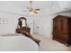 Large main bedroom suite with a comfortable bed and wood furniture at 11917 Ulsten Ln, Huntersville, NC 28078